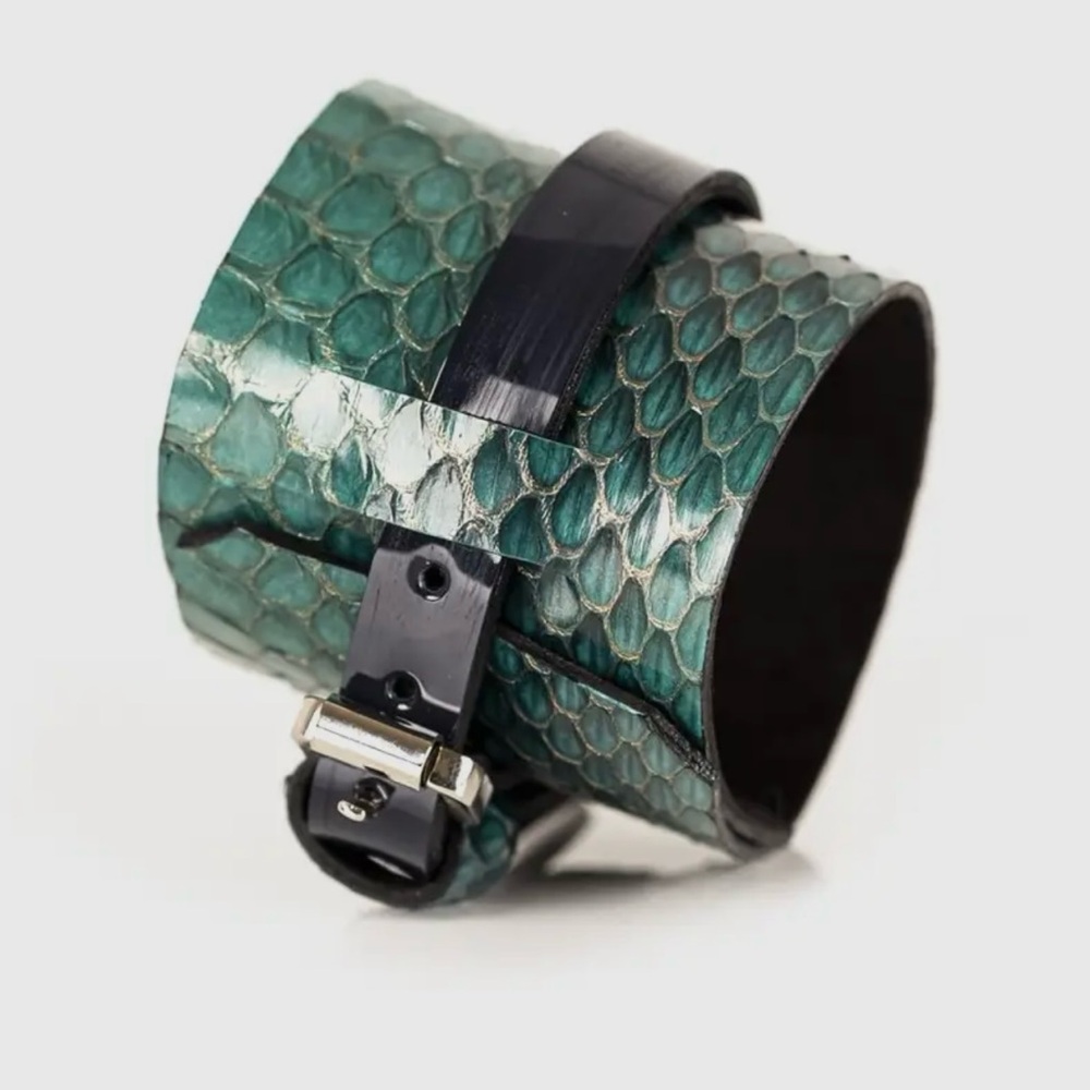 Bracelet cuff, teal green with a black patent strip of leather over top.